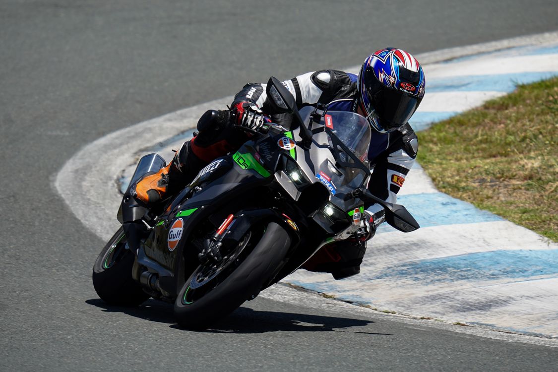 A person riding a motorcycle on a track · Free Stock Photo
