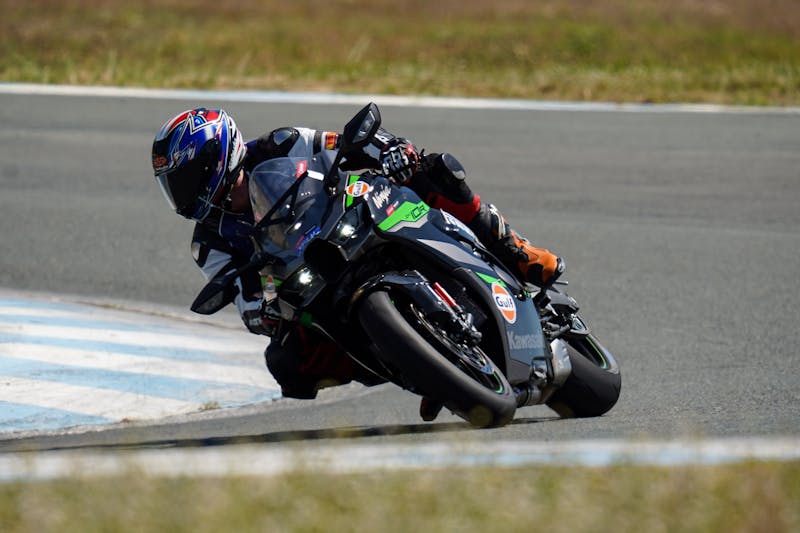 A Racer Riding His Motorcycle in the Race Track · Free Stock Photo