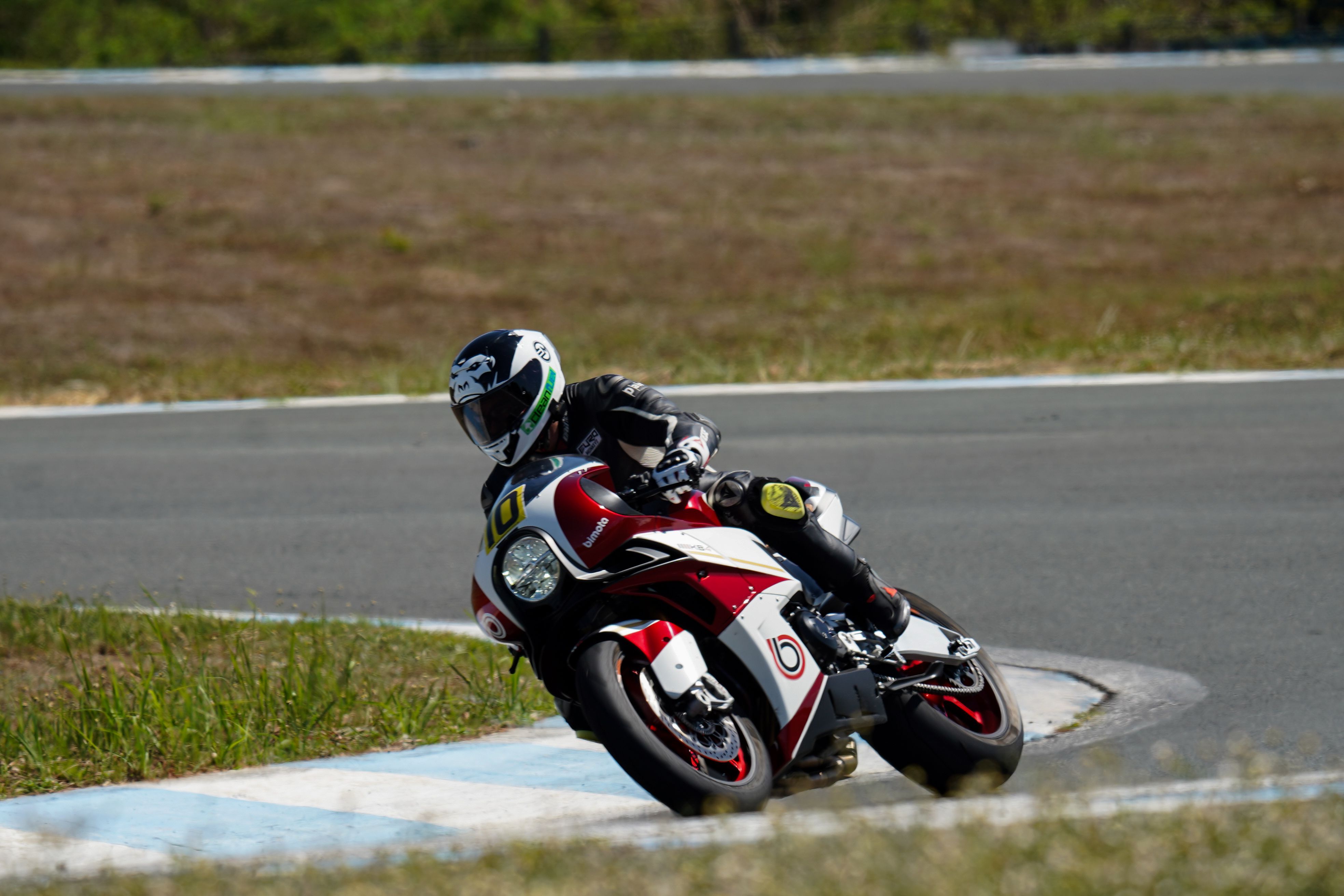 A person riding a motorcycle on a track · Free Stock Photo