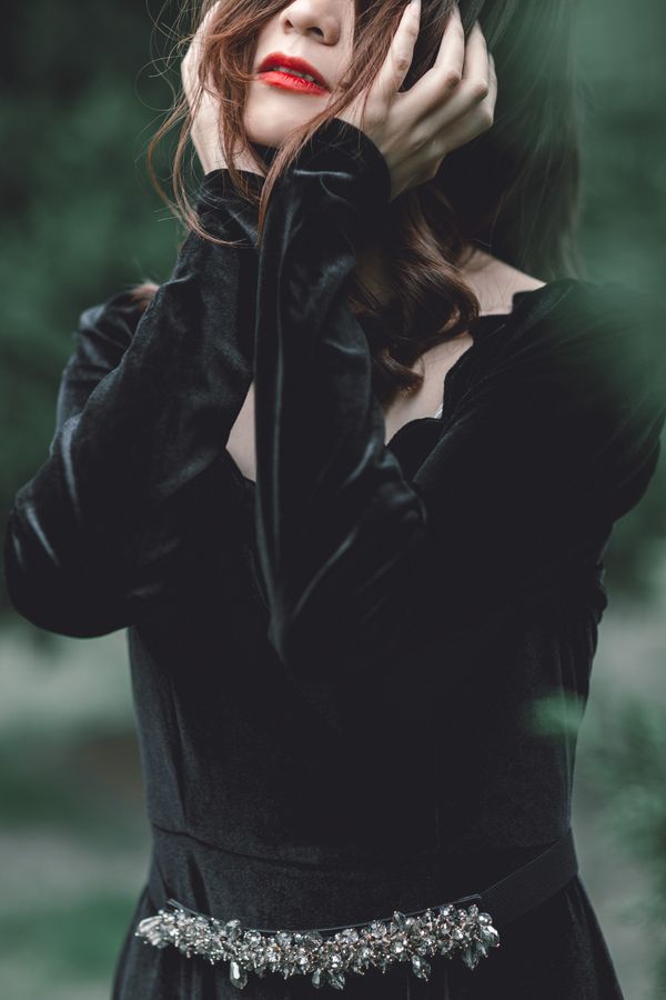 Woman in jewel-tone velvet dress