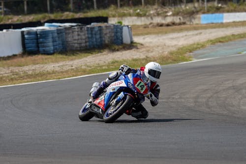 Rider's Riding on Gray and Black Sports Bike · Free Stock Photo