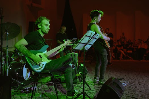 Enthralling live band performance with musicians playing electric guitars on stage.
