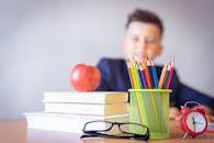 Boy Looking On A Tidied Desk