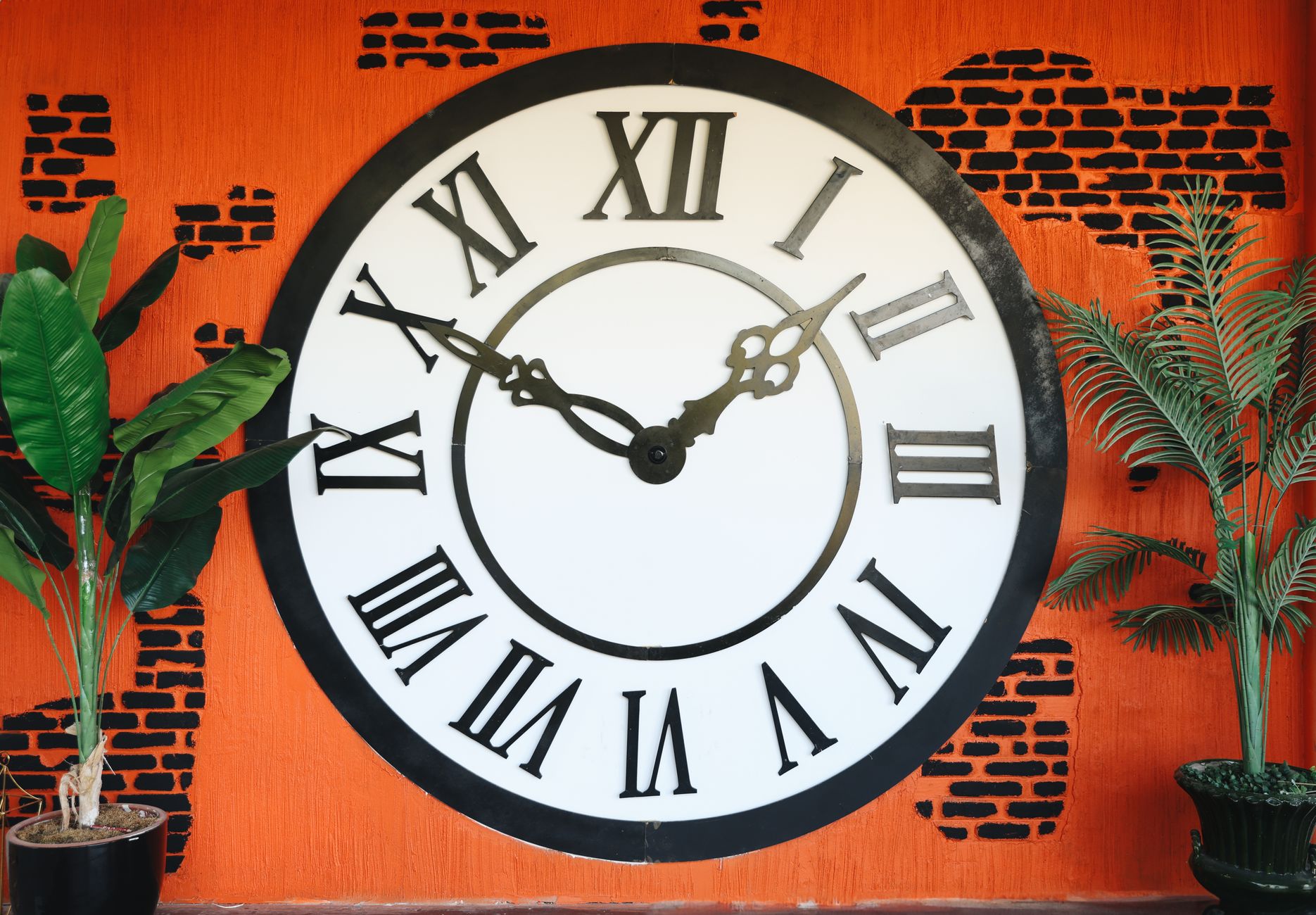 Football transfer deadline clock beside contract papers, stadium lights glowing during a tense summer evening