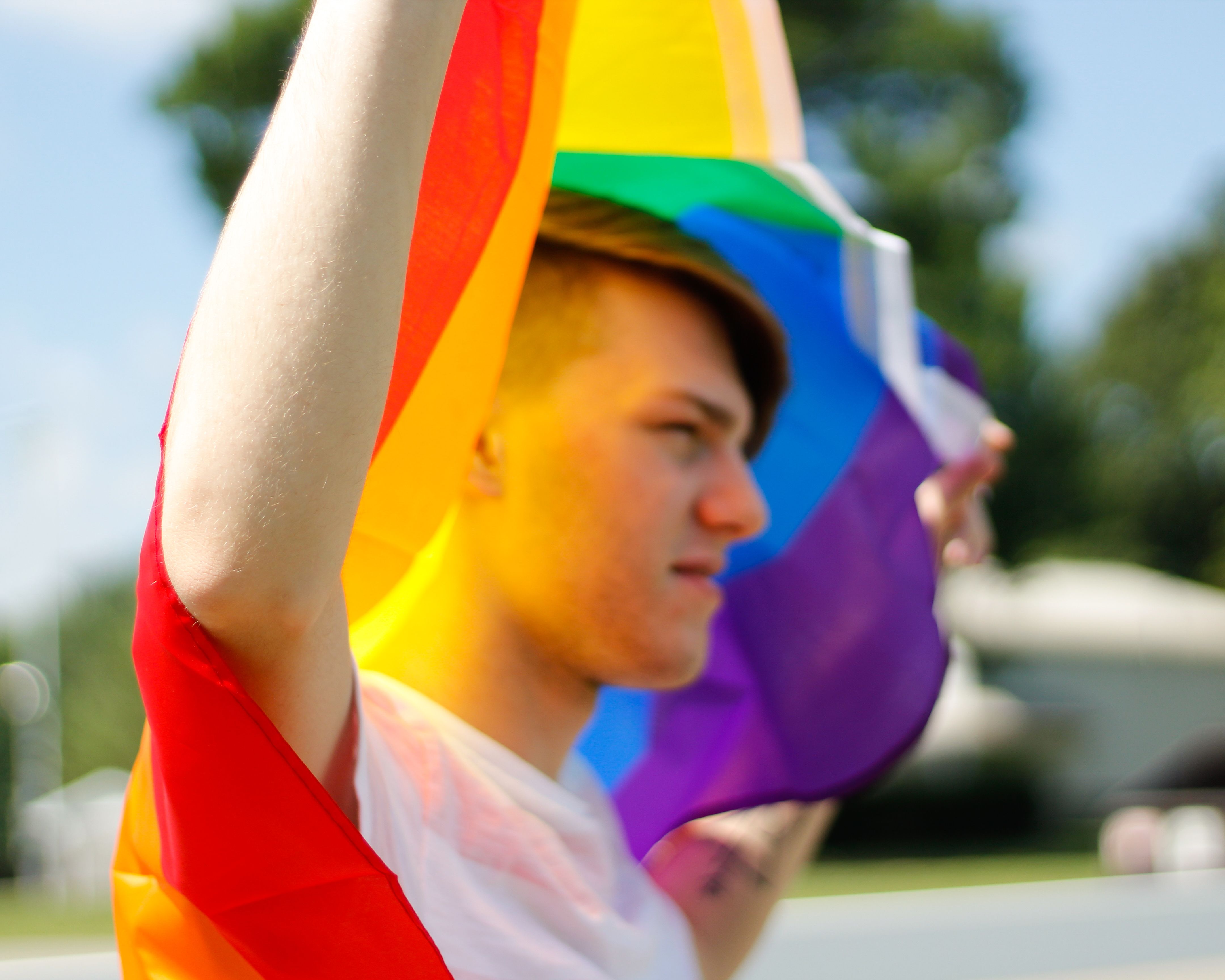 Man Holding Pride Flag · Free Stock Photo