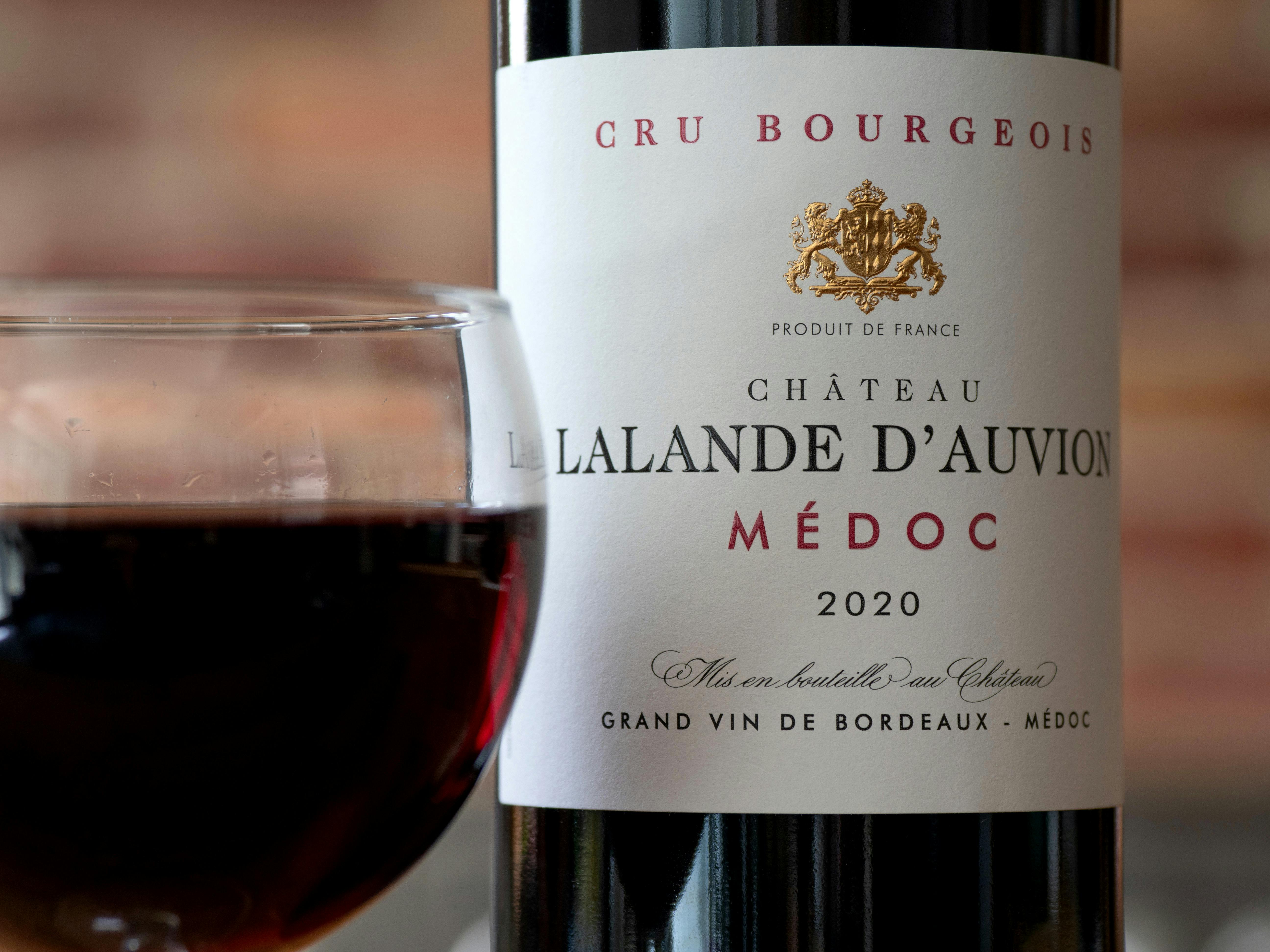 Close-up of Chateau Lalande D'Auvion Médoc 2020 wine and glass. Perfect for luxury dining.