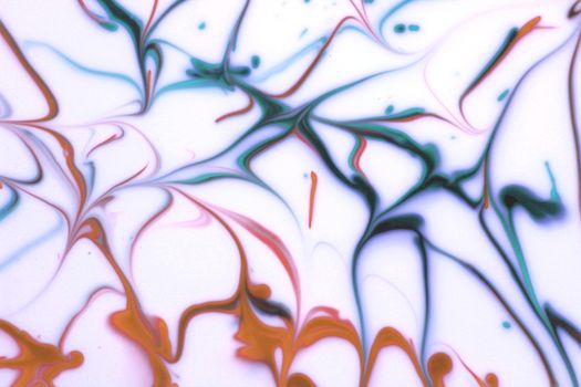 Colorful abstract fluid design with dynamic swirls and patterns creating an artistic visual flow.