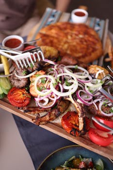 A mouthwatering assortment of grilled meats and fresh vegetables, perfect for dining.