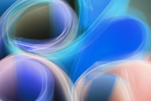 Free A dynamic abstract image featuring vibrant light waves in blue and pink hues, creating a surreal design. Stock Photo