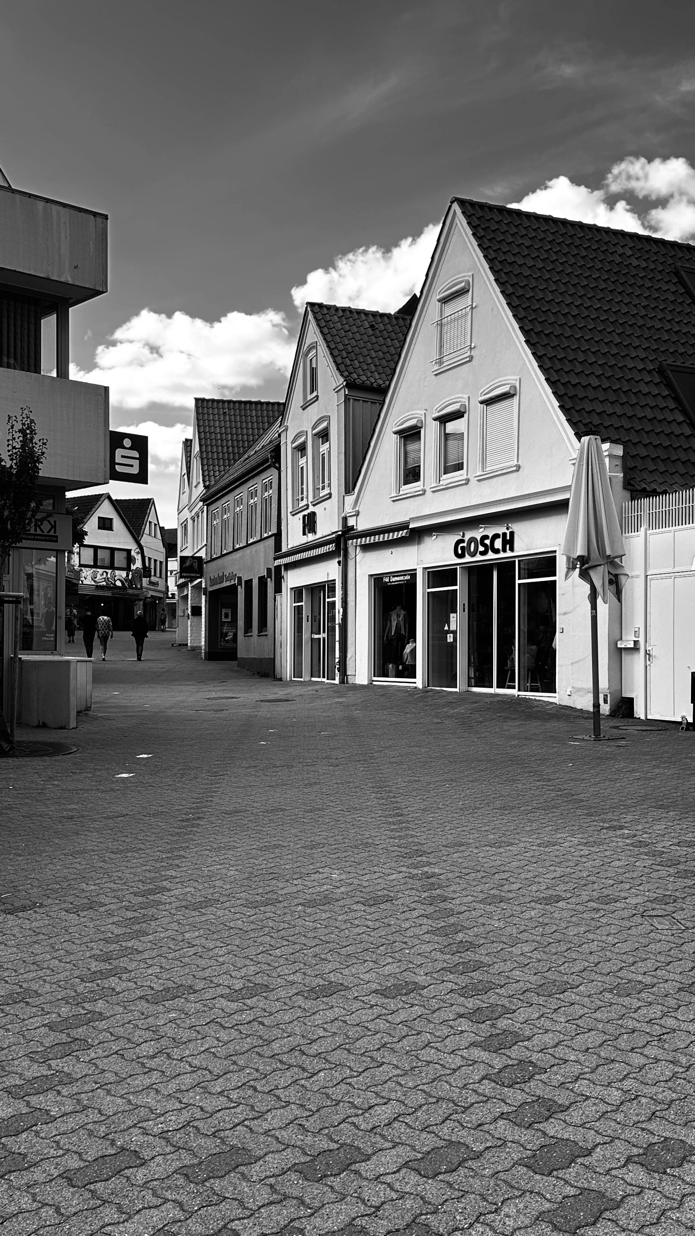 UK village commercial shop in a rural or traditional village setting, avoiding high-rise or modern urban buildings