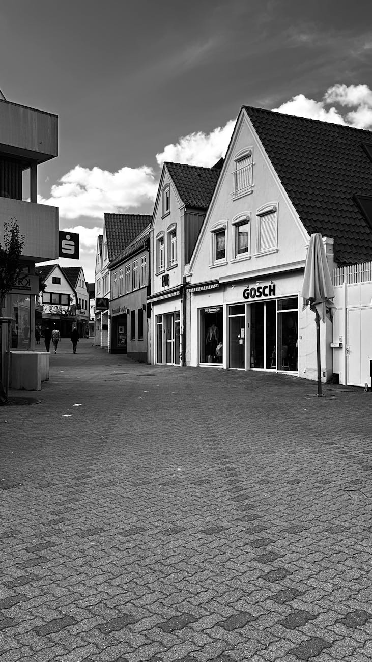 UK village commercial shop in a rural or traditional village setting, avoiding high-rise or modern urban buildings