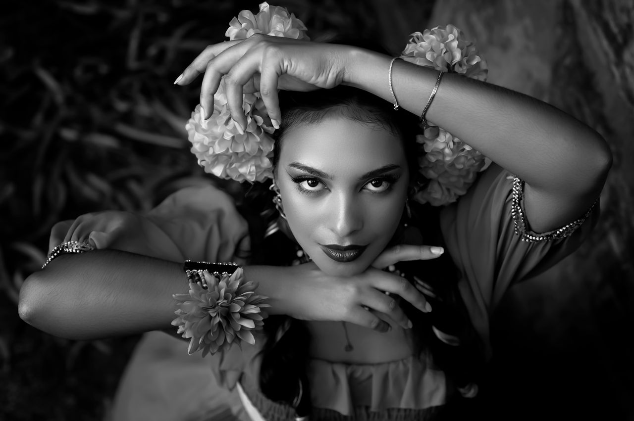 black and white portrait of an elegant woman with a floral headdress i