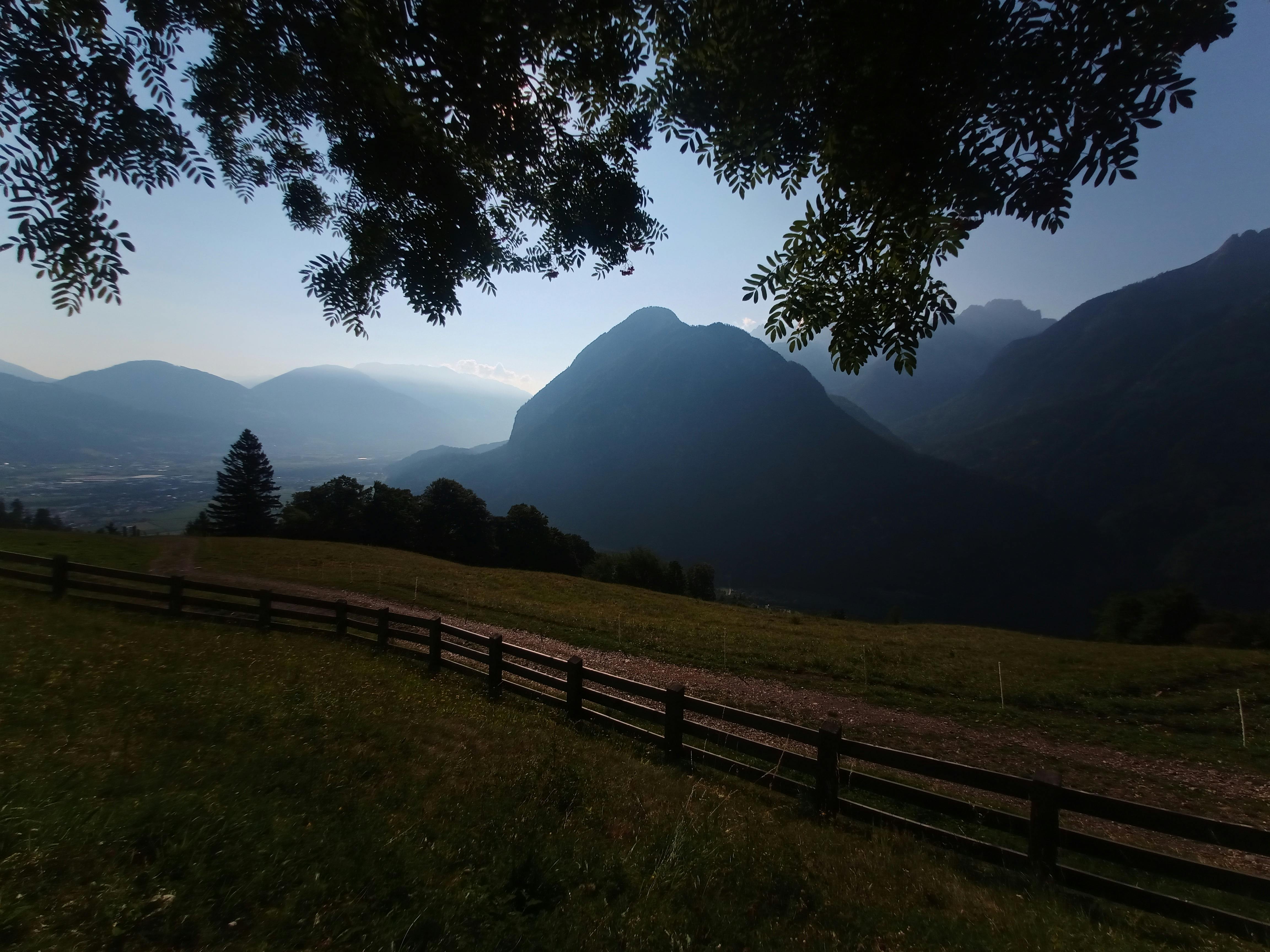 a view of a valley with mountains in the distance