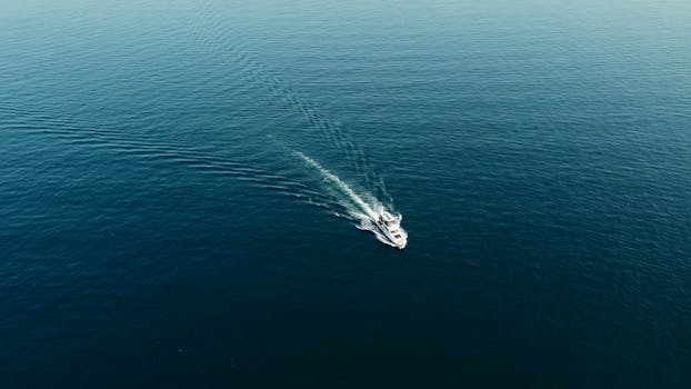 Drone captures a lone boat navigating the tranquil waters around Heybeliada, İstanbul.