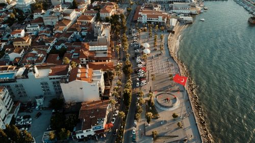 Free Stunning aerial view of Kuşadası, Türkiye, featuring the waterfront and urban architecture at golden hour. Stock Photo