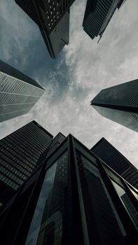Captivating view of modern skyscrapers in downtown Toronto under a dramatic sky.