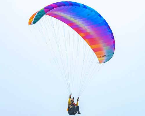 Free Experience the thrill of colorful paragliding over Lima, Peru. A vivid blend of colors captures the essence of freedom and adventure. Stock Photo