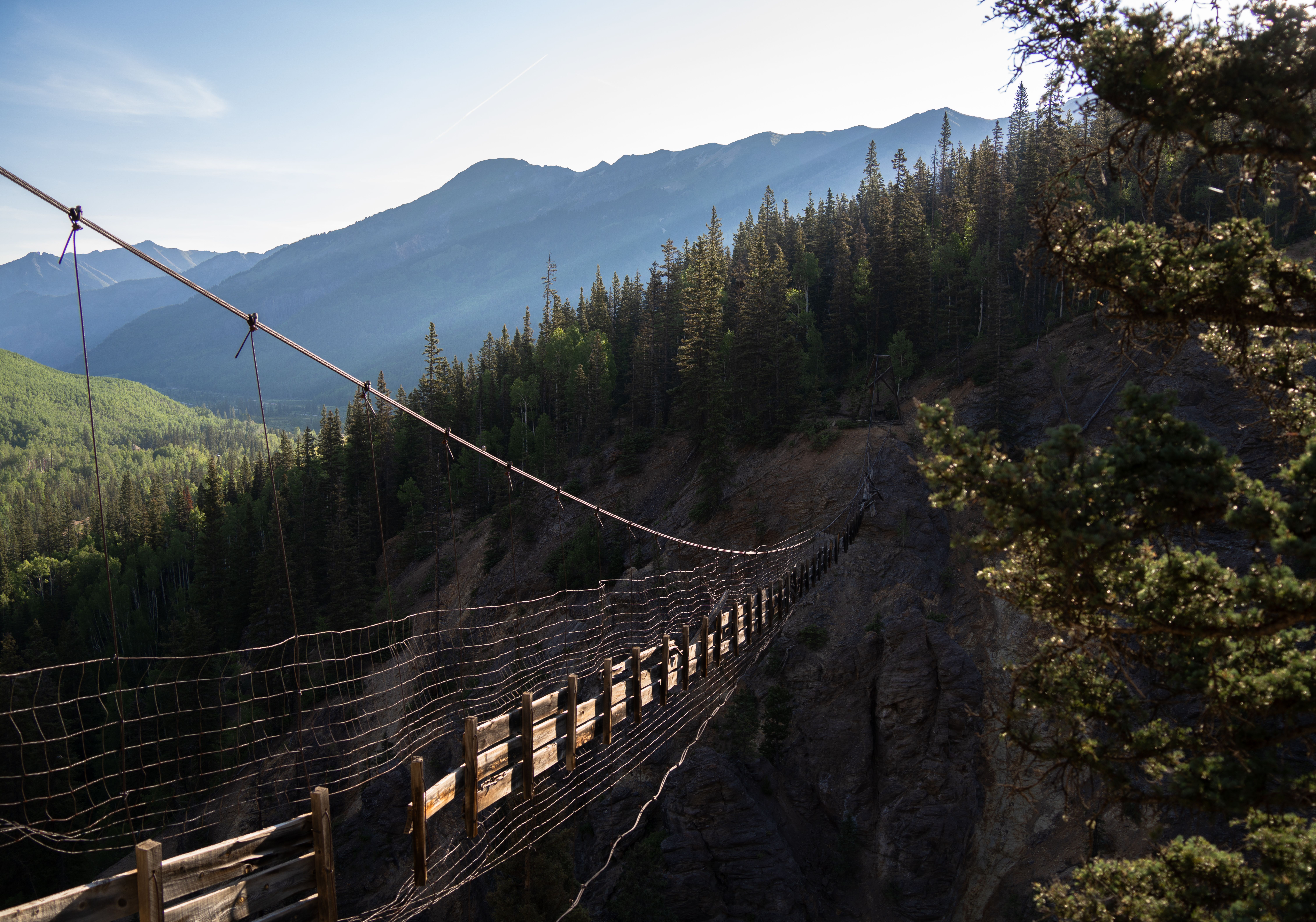 A suspension bridge over a river · Free Stock Photo