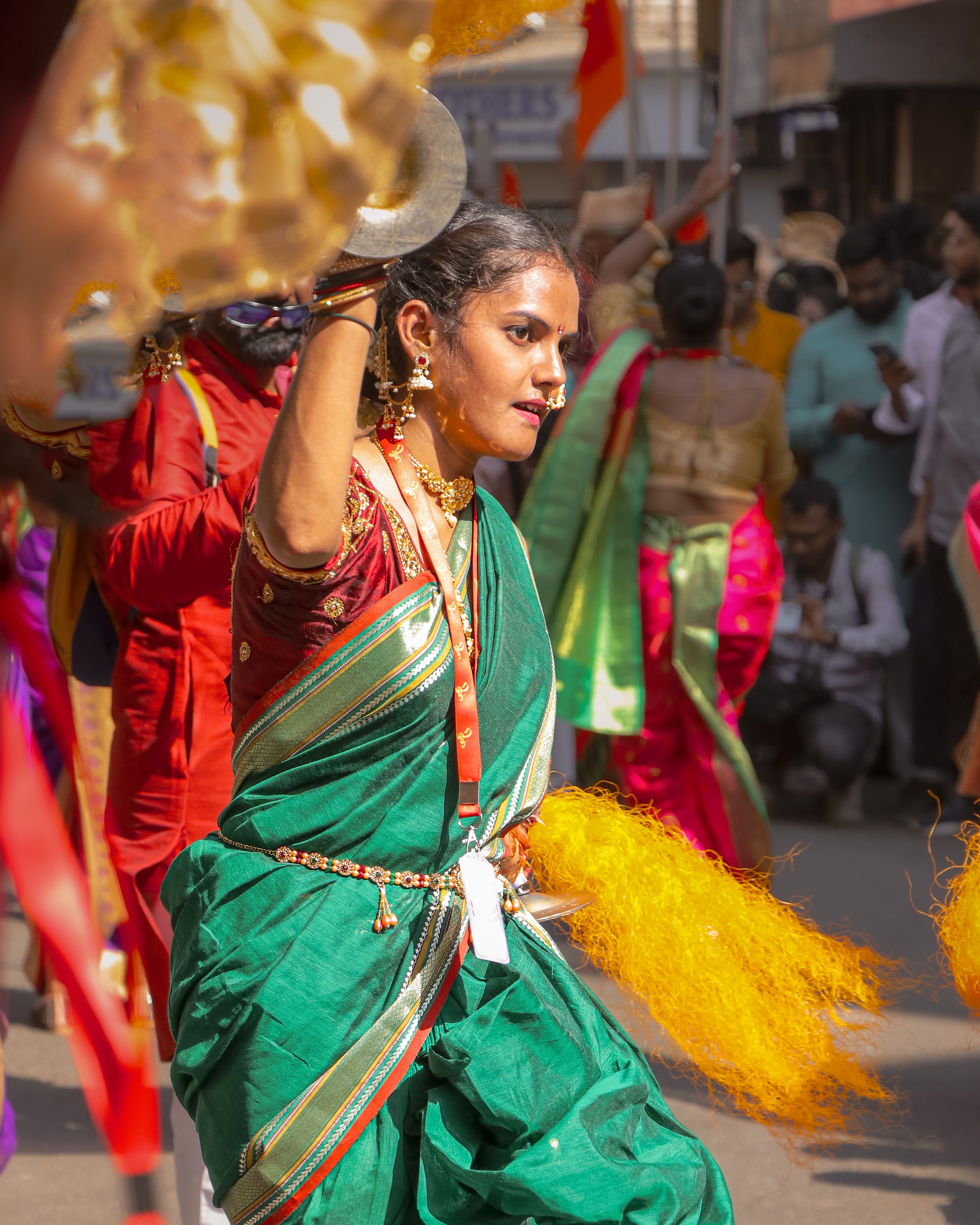Colorful street dance performance during an Indian cultural festival showcasing traditional attire.