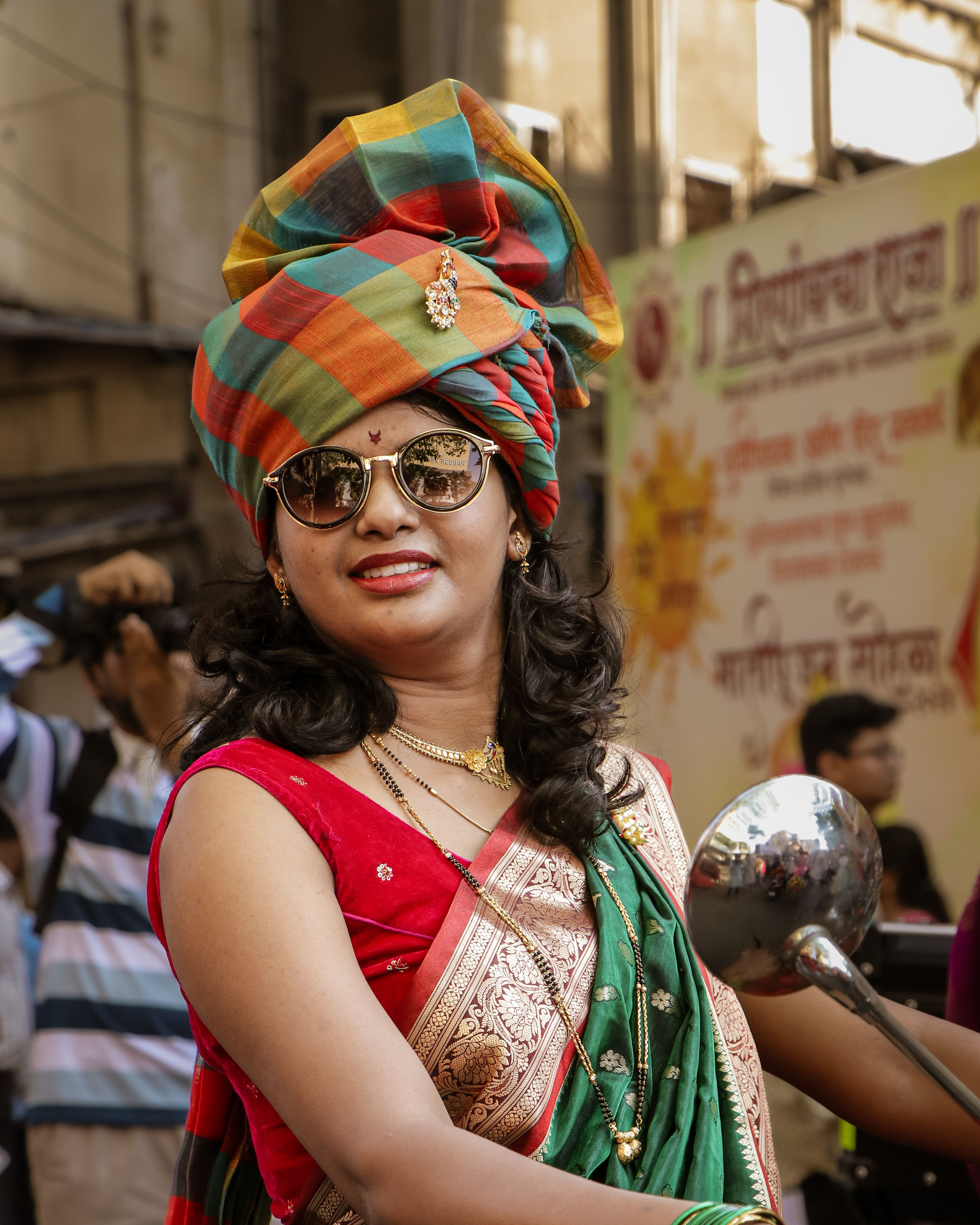 A woman in a colorful sari riding a motorcycle · Free Stock Photo