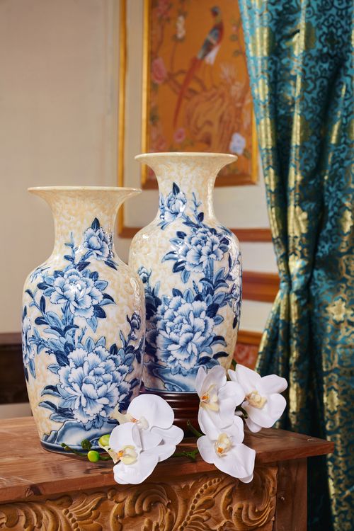 Free Charming blue floral porcelain vases with white orchids in a luxurious traditional setting. Stock Photo
