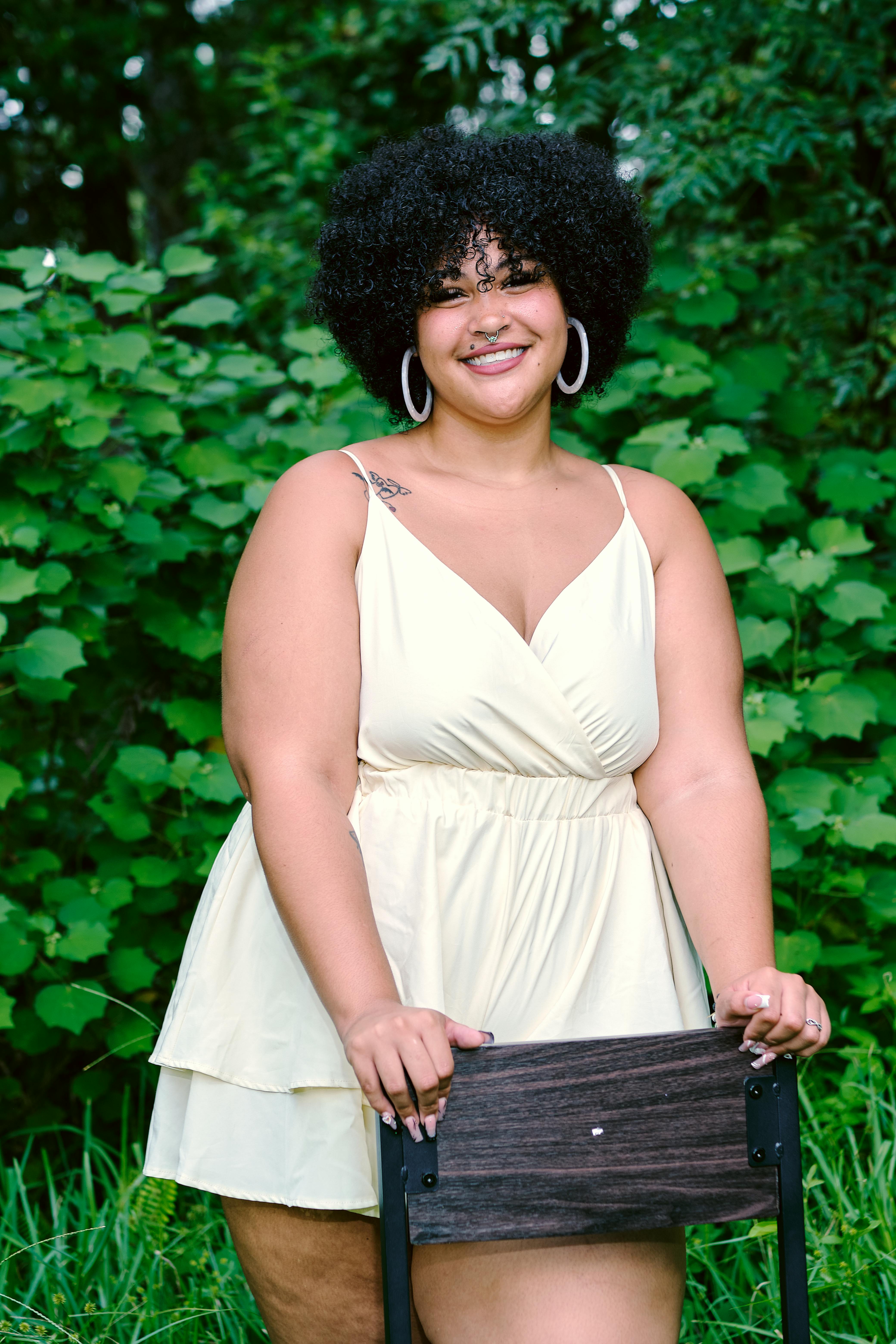 a woman in a white dress and black shoes