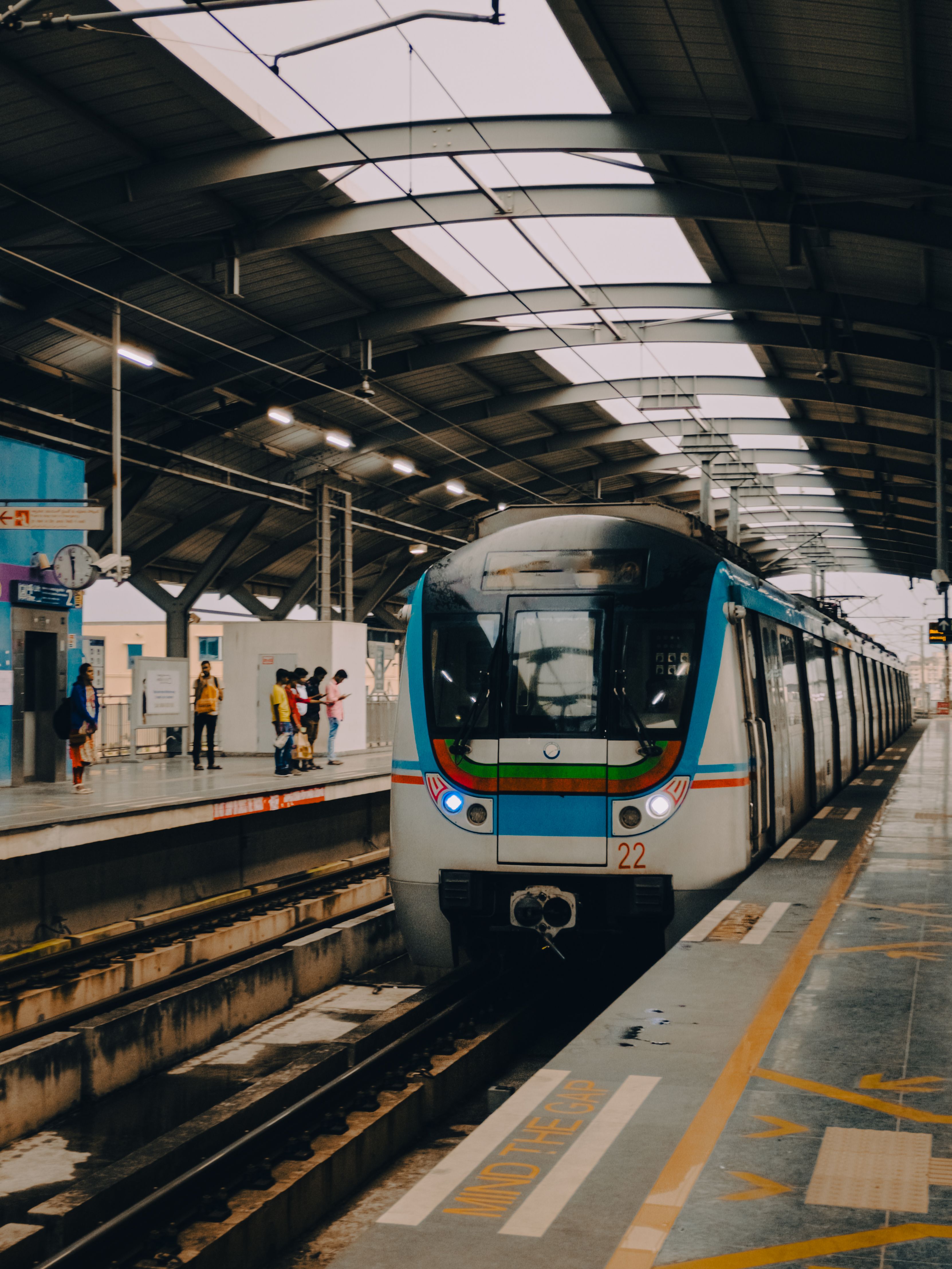A metro train arrives at a contemporary station in Hyderabad, showcasing urban transit.