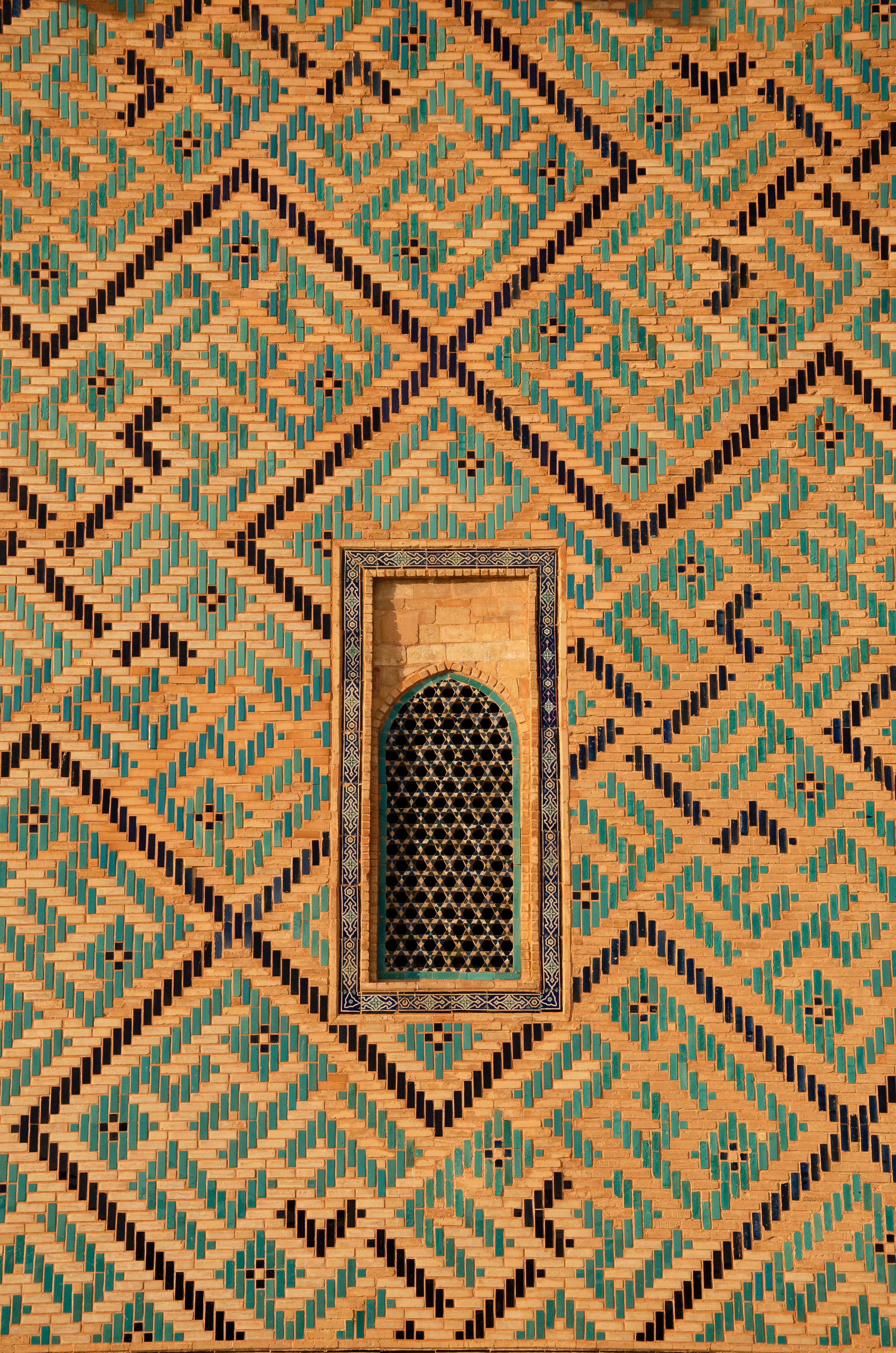 Detailed view of geometric patterns on a traditional structure in Turkistan, Kazakhstan.