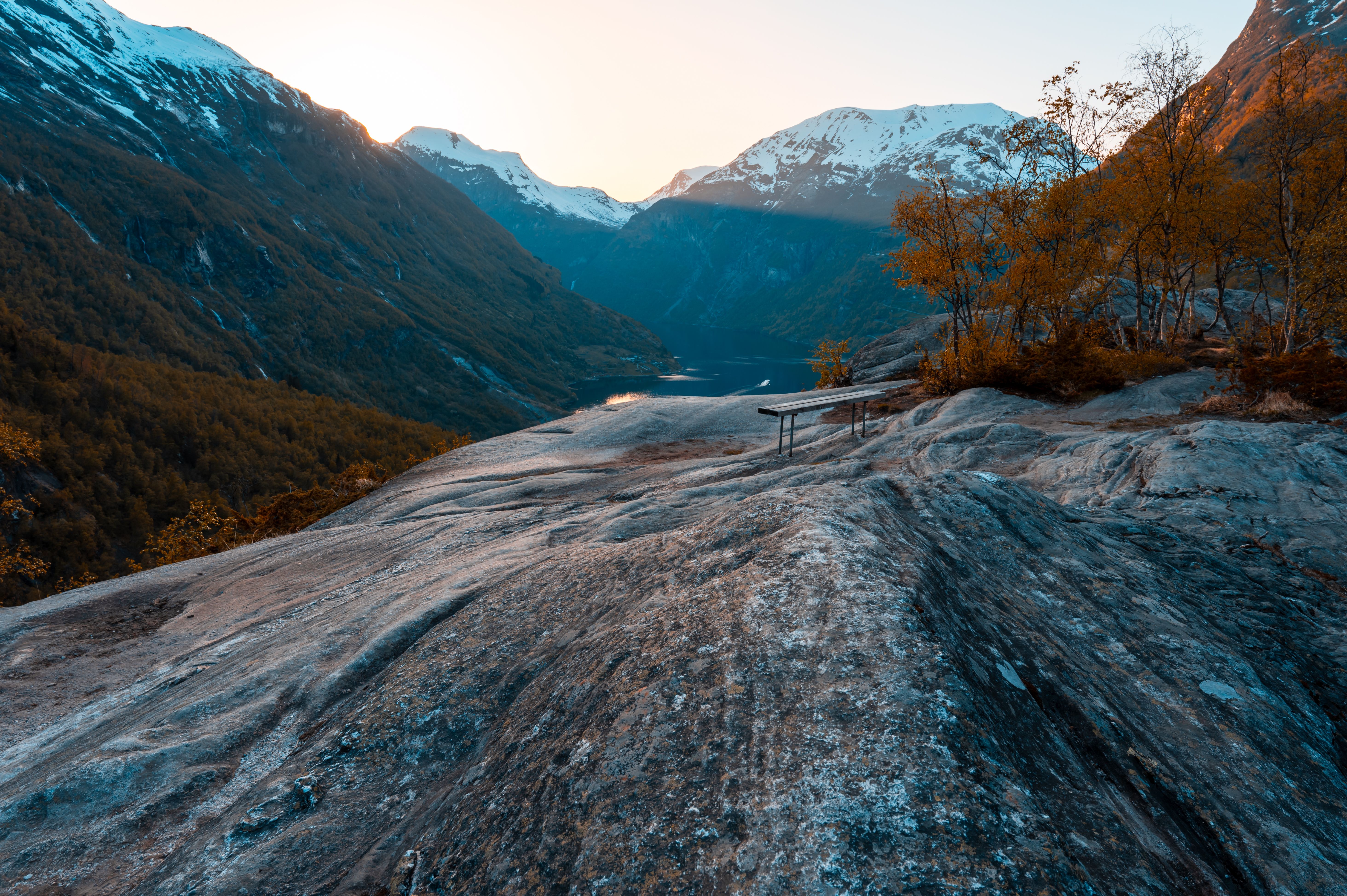 A mountain with rocks and trees in the background · Free Stock Photo