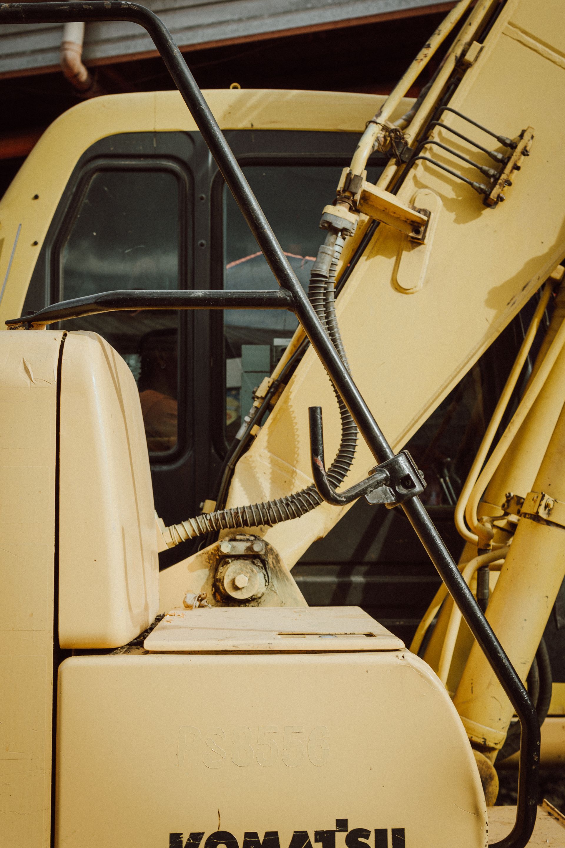 Close-up of a vintage Komatsu excavator showcasing hydraulic machinery details