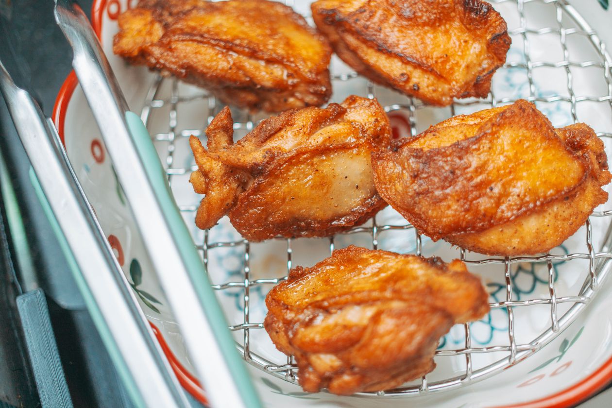oil temperature for fried chicken - golden brown pieces resting on a wire rack after the 325-350°F fry