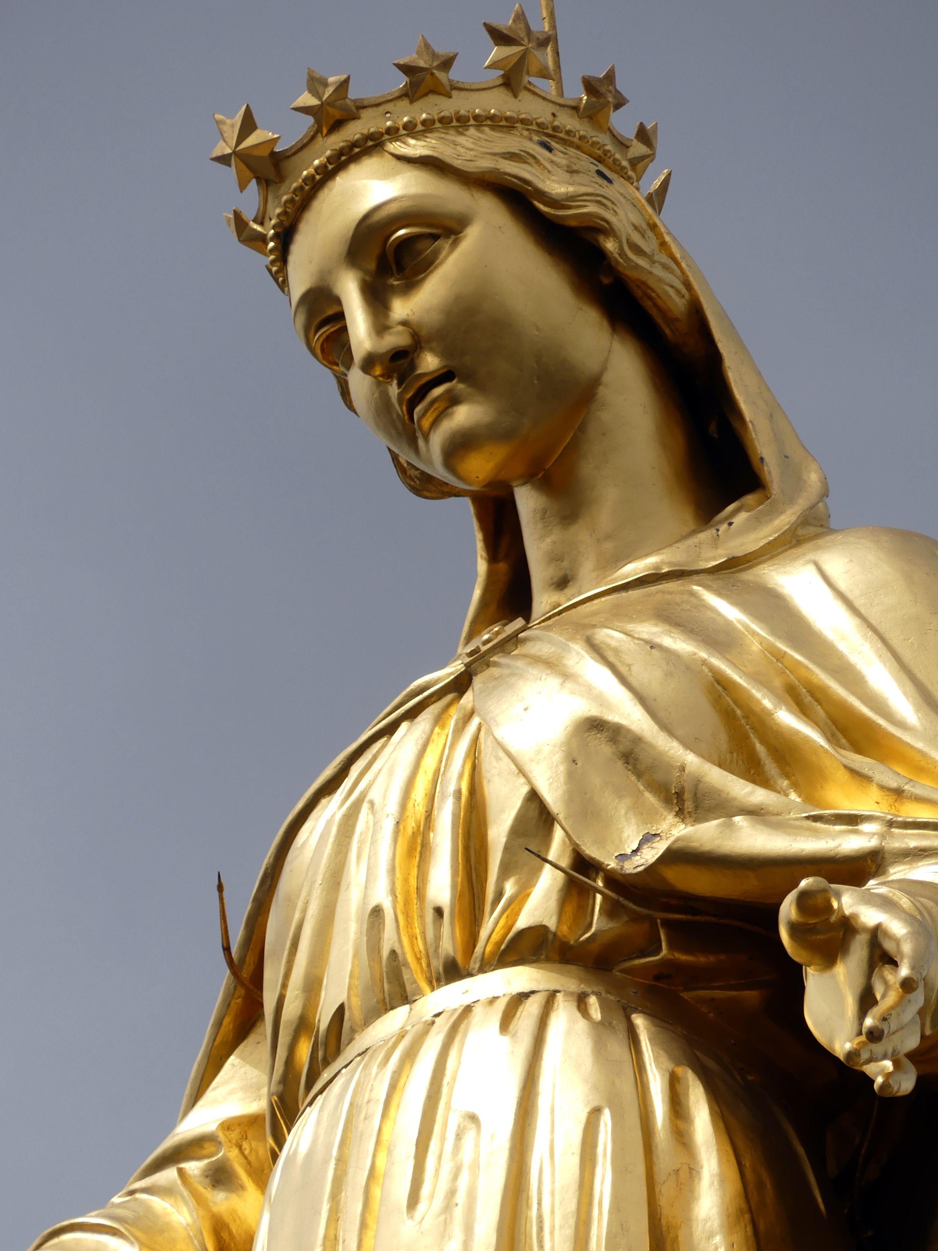 Magnificent golden statue of Holy Mary in Lyon, showcasing religious artistry and spirituality.