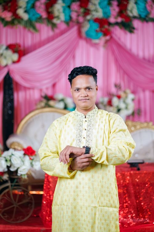 Free Man in traditional attire at a festive event in Bangladesh. Stock Photo