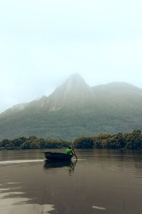 A sculler on the water at first light