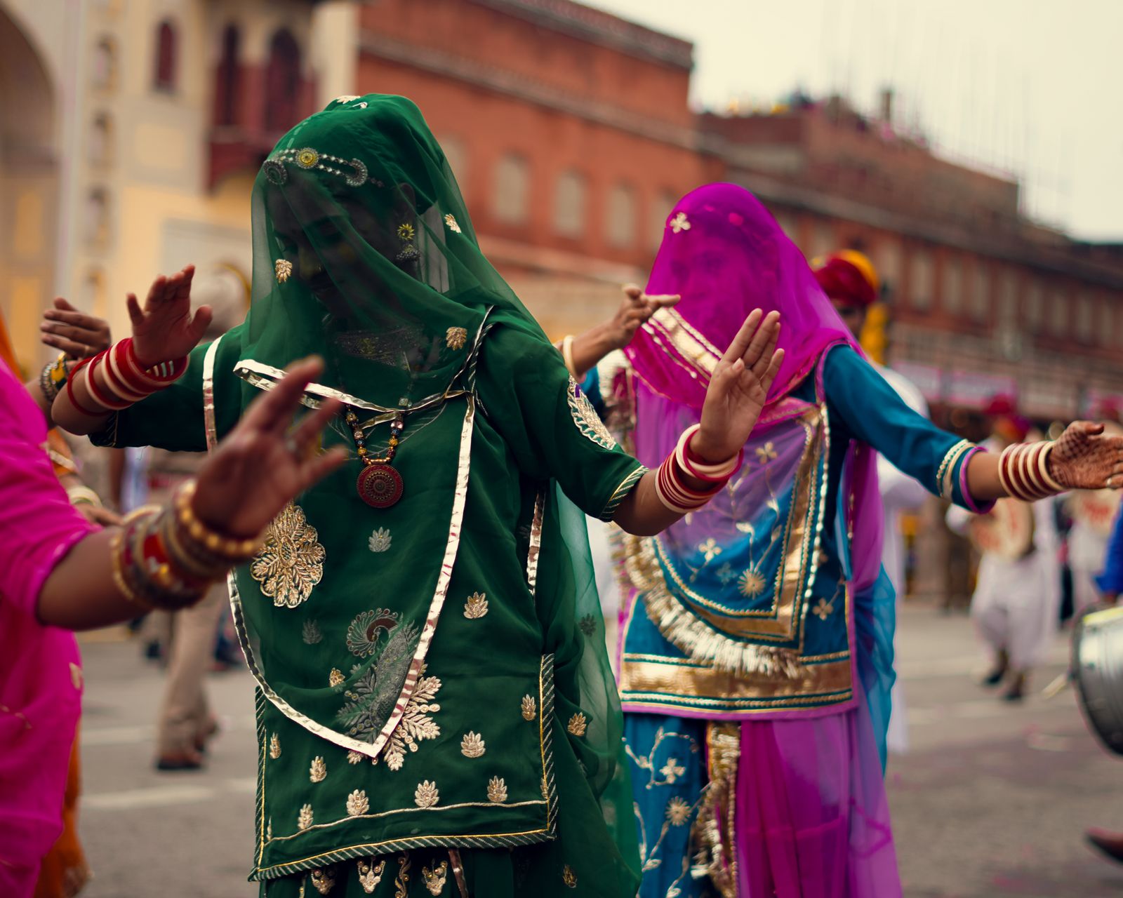 Group performing a colourful Bollywood stage dance
