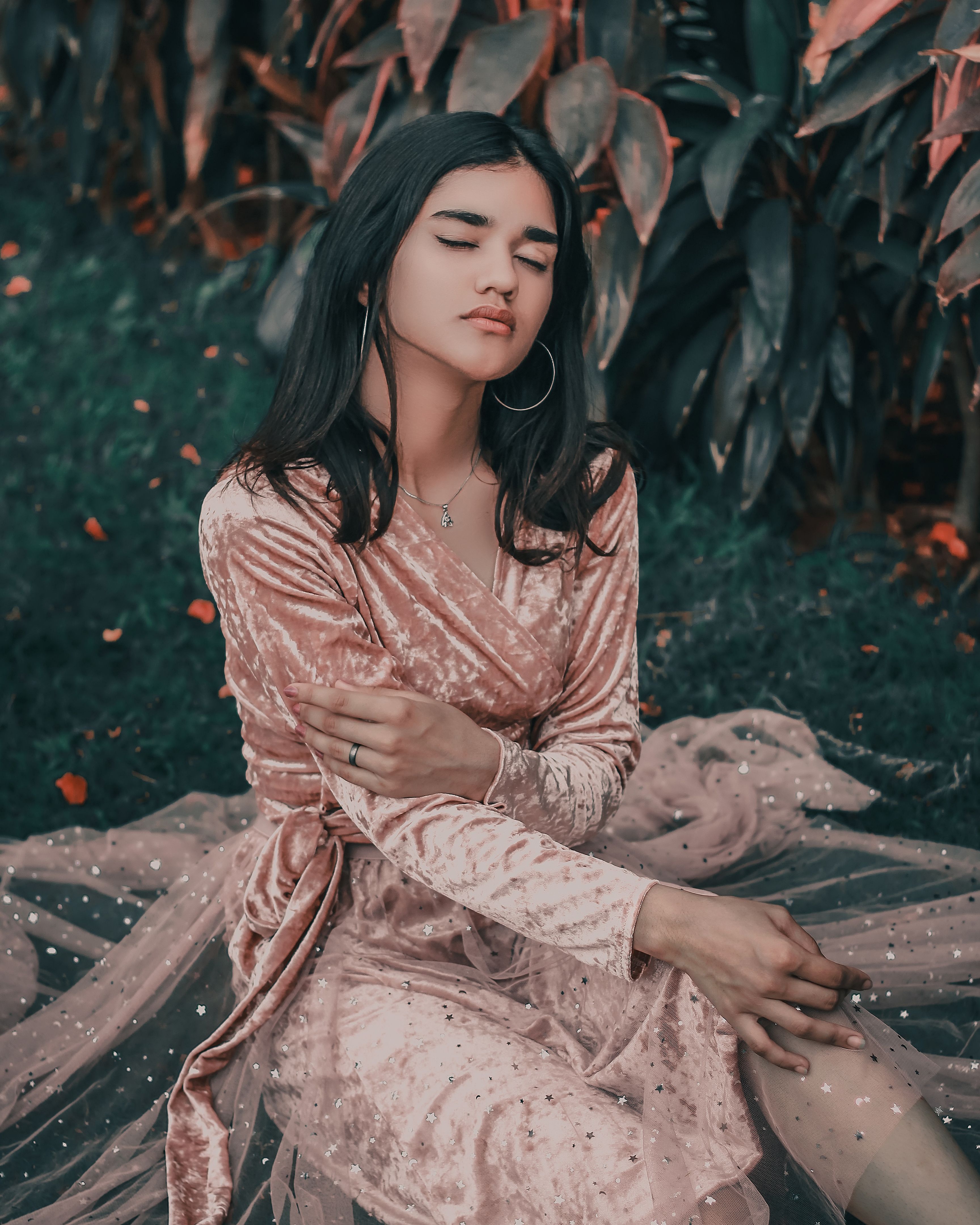 woman in blush pink velvet mini dress