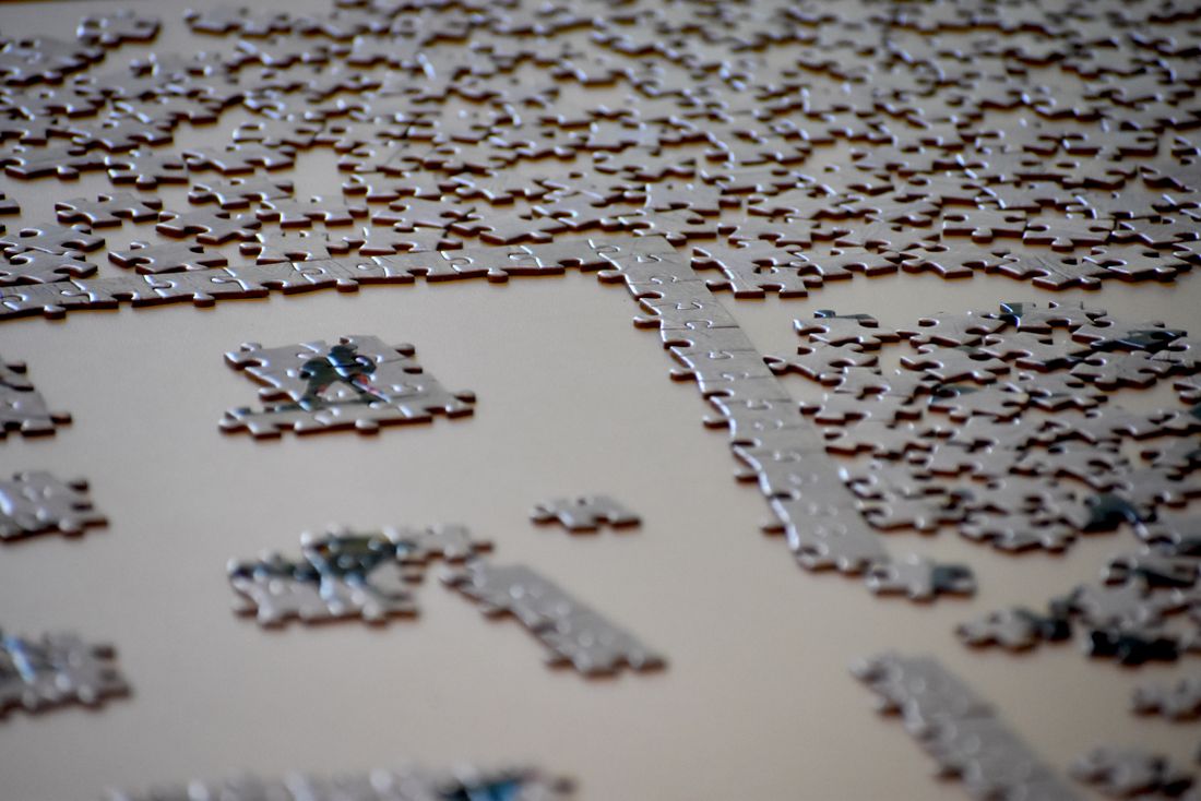 Jigsaw puzzle in progress on a table