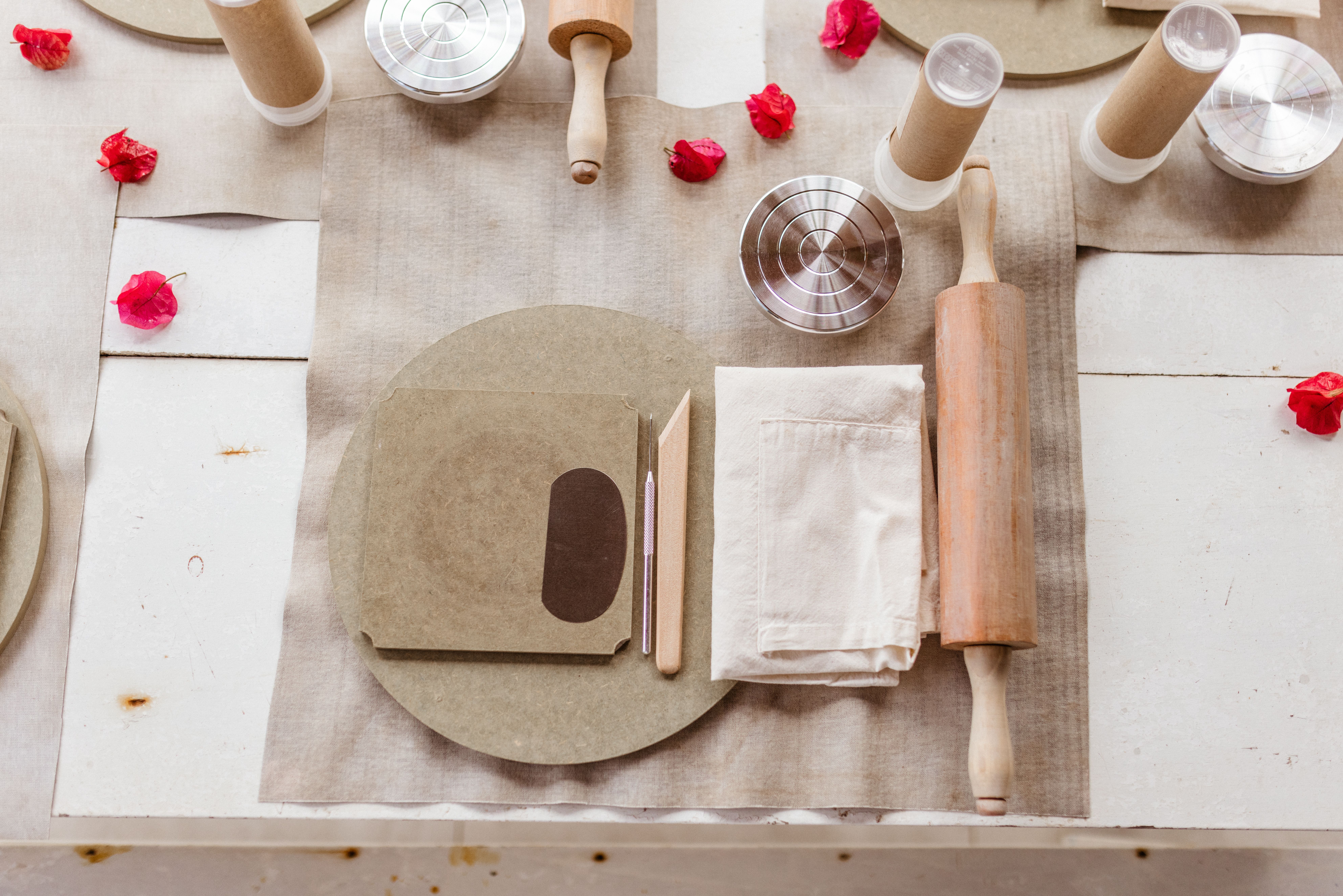 A table with a wooden cutting board and a wooden rolling pin · Free ...
