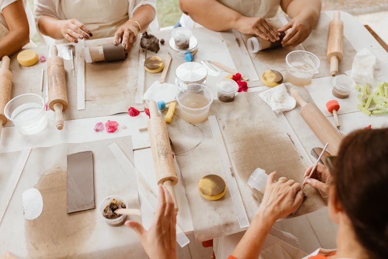 Group of friends crafting at a table
