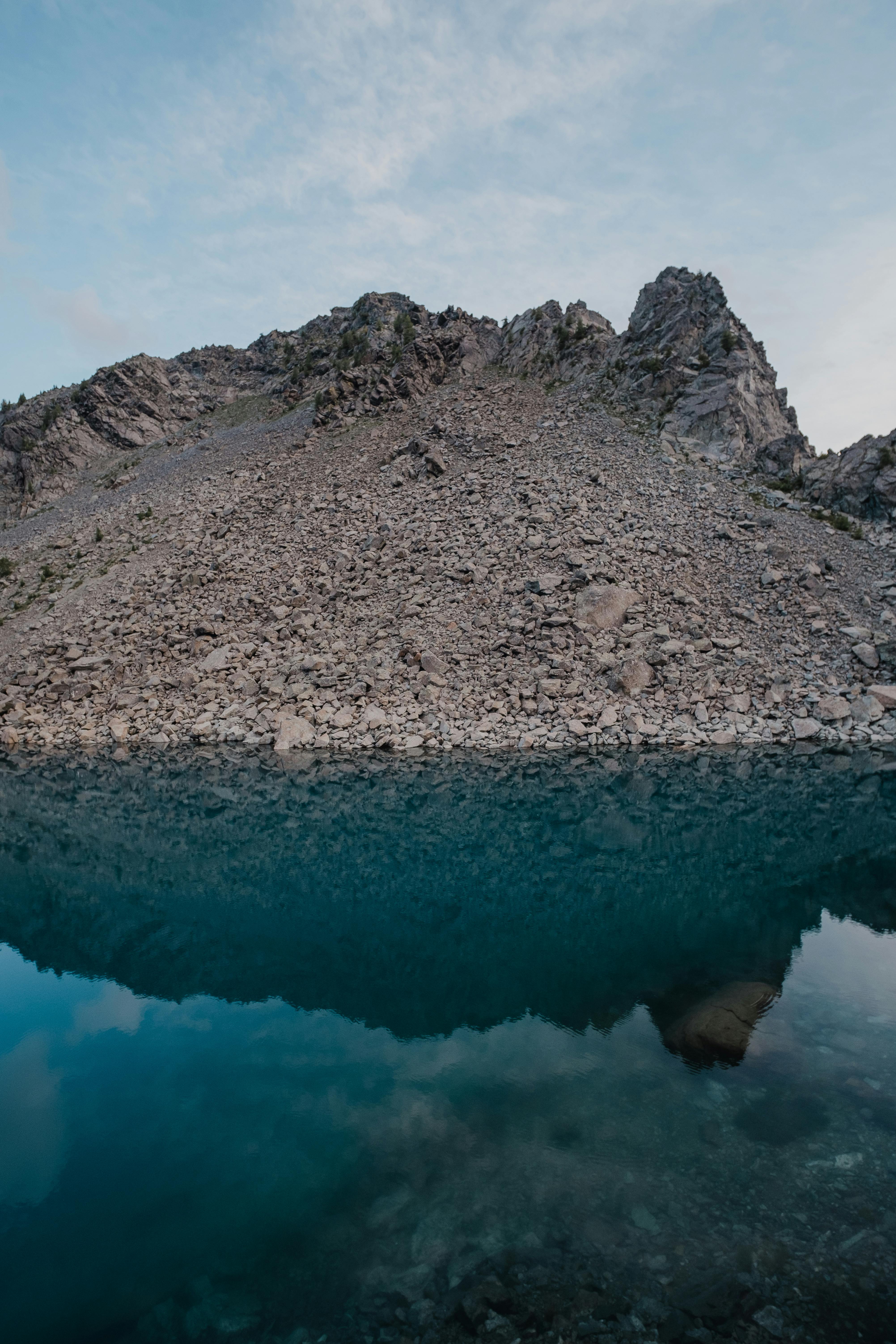 a mountain with a lake in the middle of it