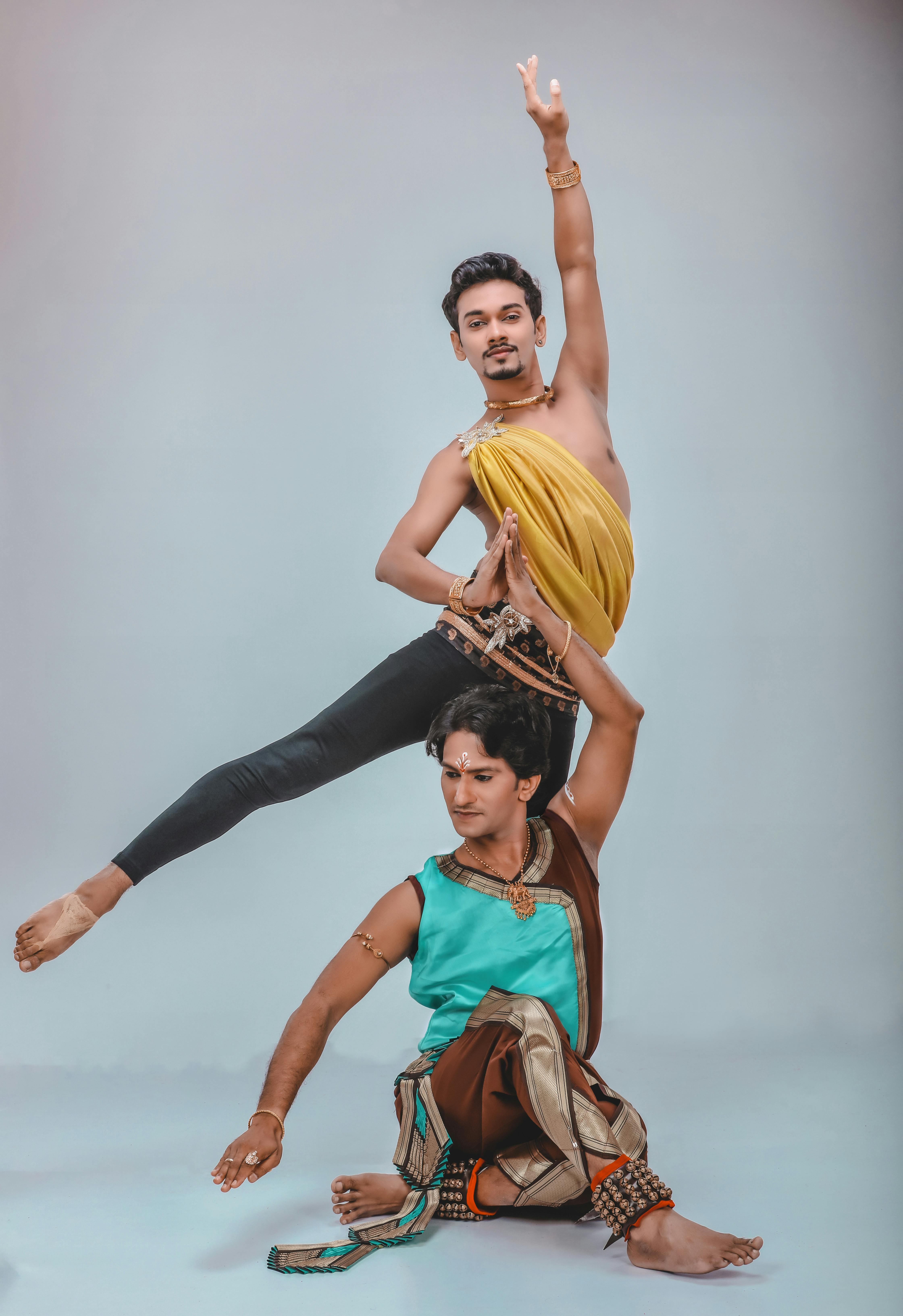 Power To Help Him Fly. Two Male Contemporary Dancers Performing a Dramatic  Pose in Front of a Dark Background. Stock Photo - Image of dance, graceful:  239207592