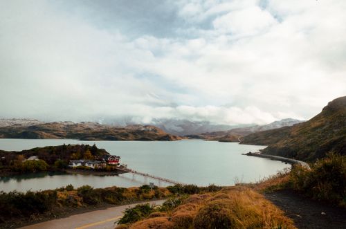 Free Breathtaking view of a fjord with mountains and a small island home in autumn. Stock Photo