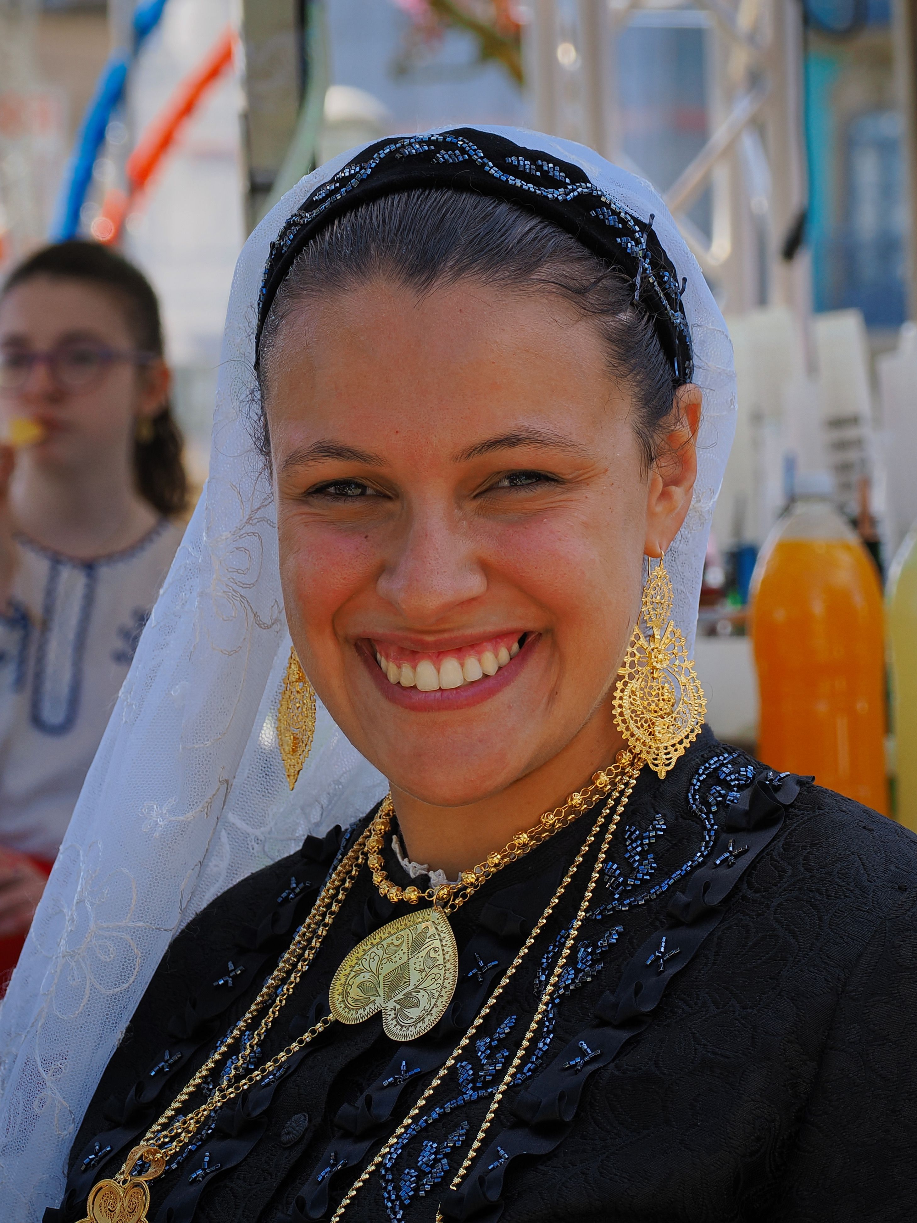 A woman in traditional dress smiling for the camera · Free Stock Photo