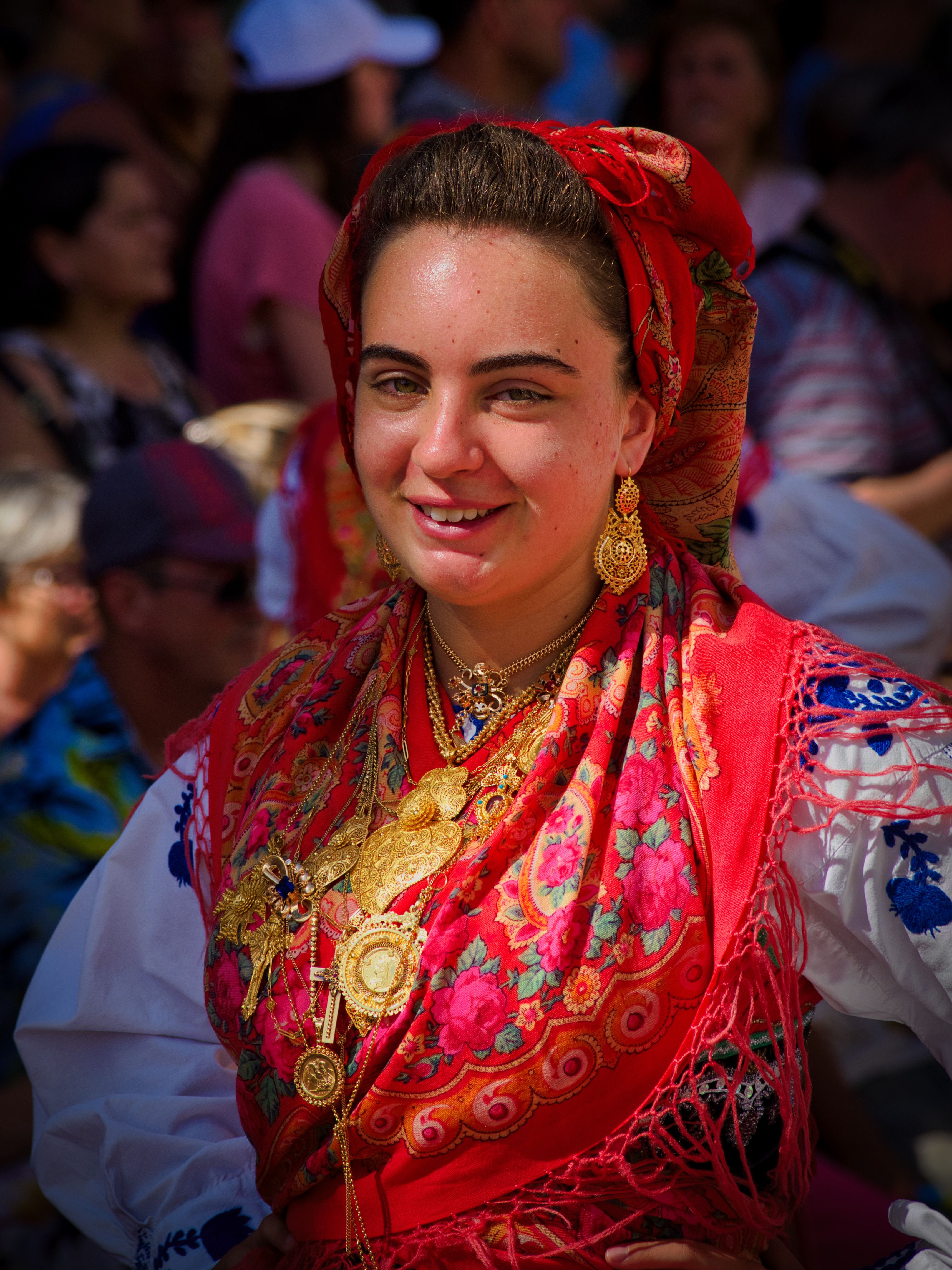 A woman in traditional clothing smiles for the camera · Free Stock Photo
