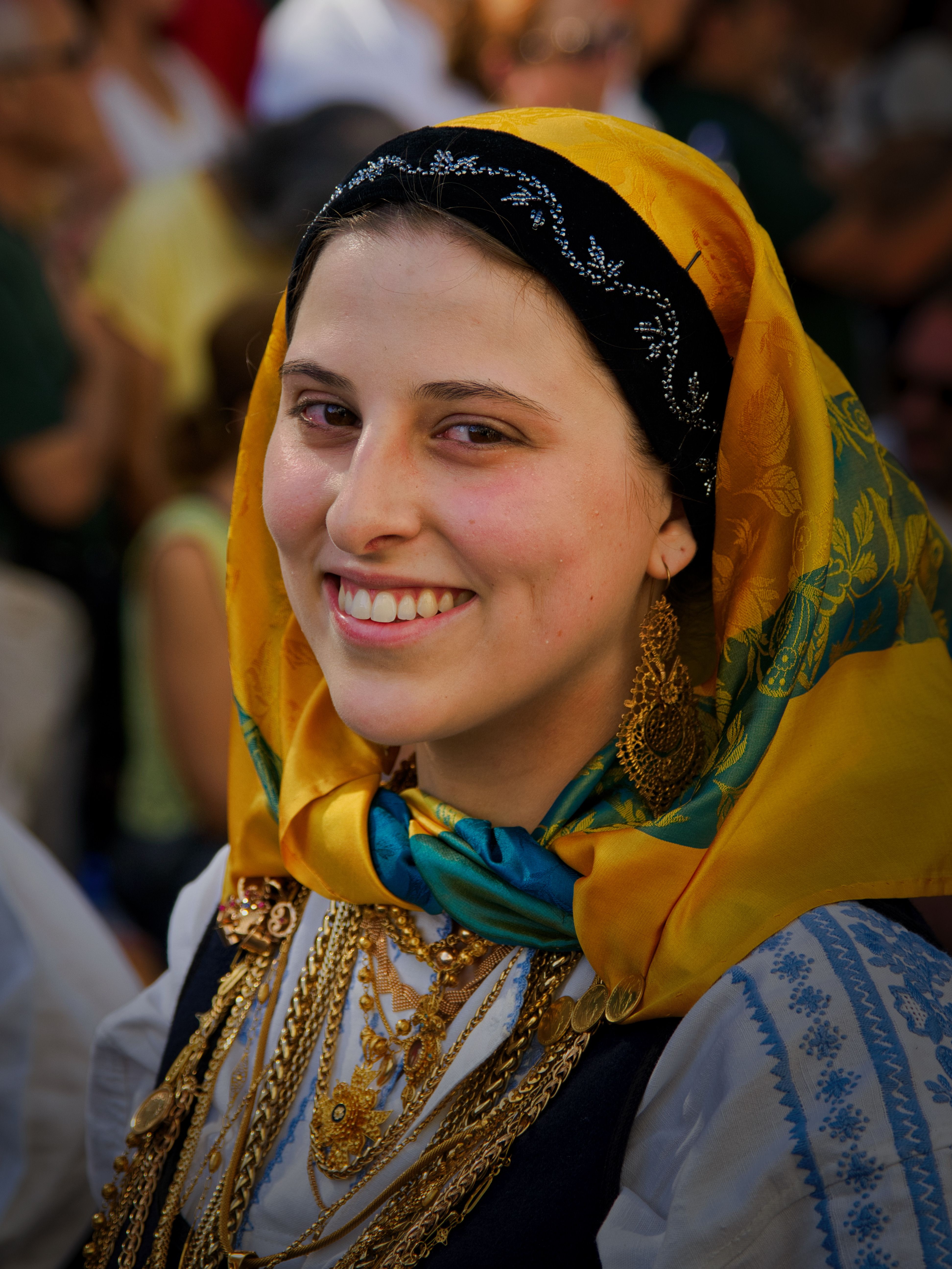 A woman in traditional clothing smiles for the camera · Free Stock Photo
