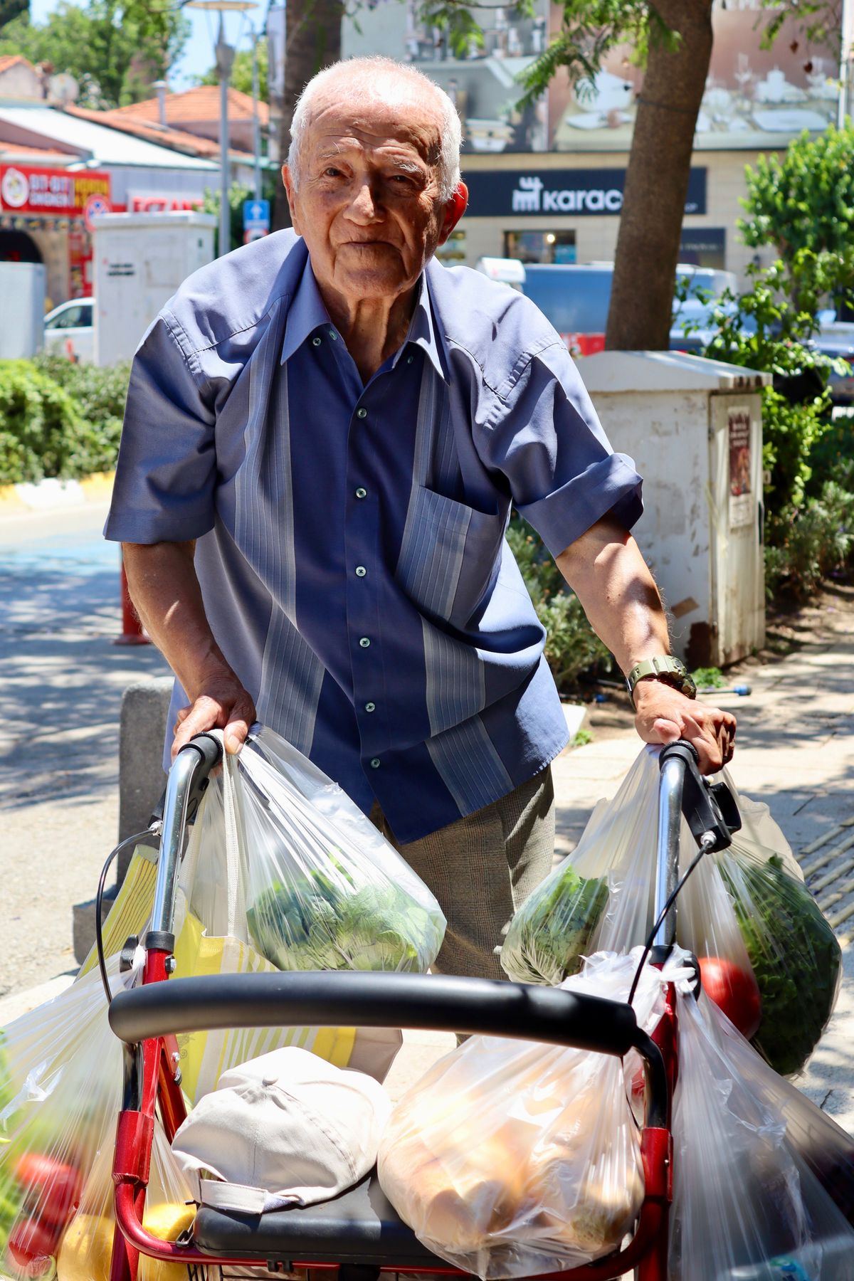 Older adult receiving support while moving safely through a public space