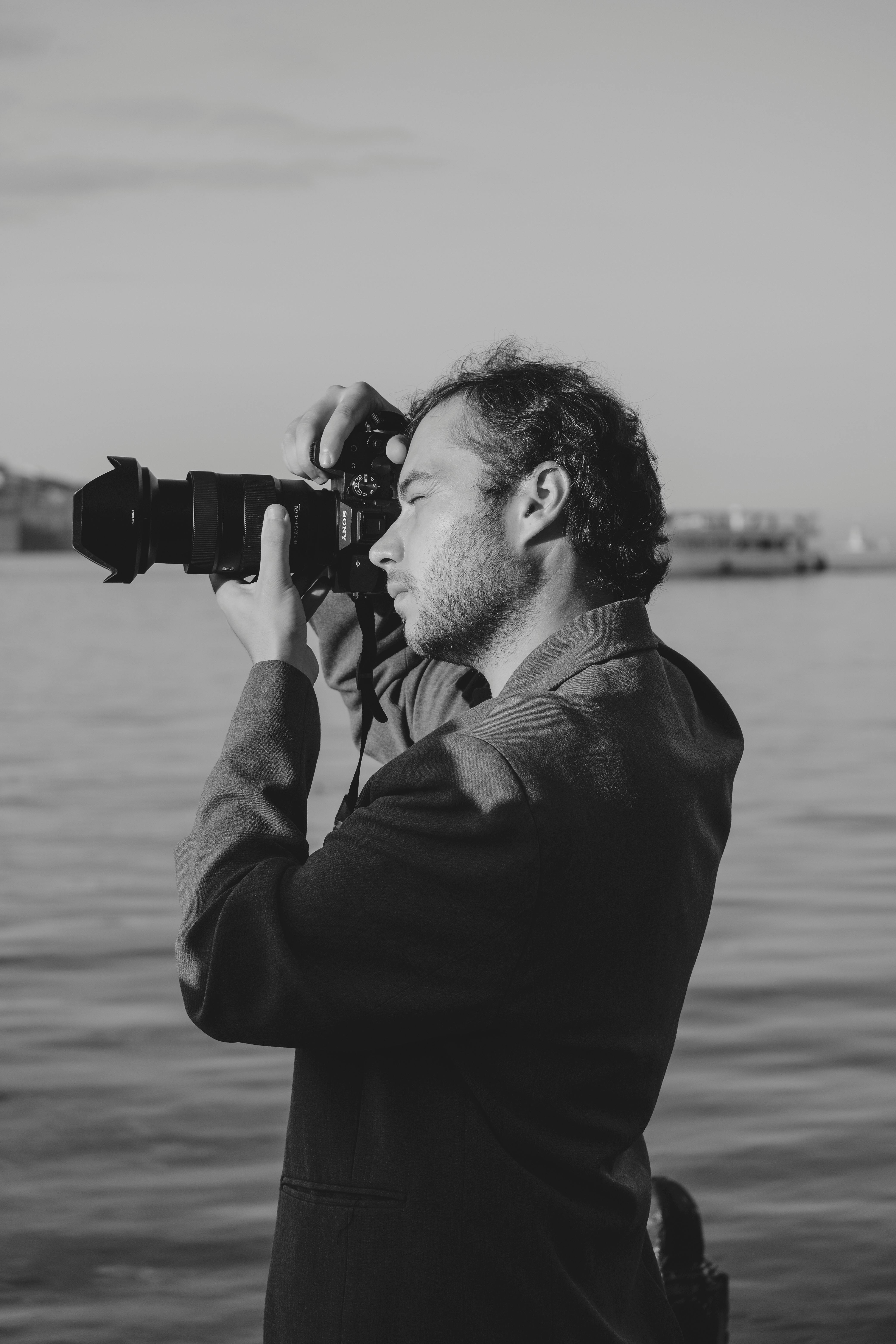 a man taking a photo of the water