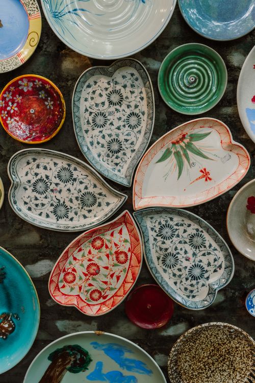 Free A vibrant collection of handmade ceramic plates featuring traditional and artistic patterns. Stock Photo