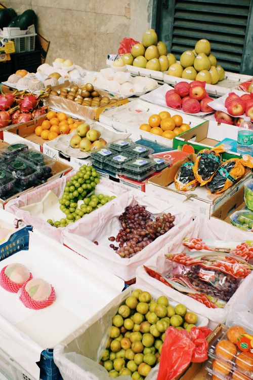 Free A colorful array of fresh fruits on a market stall, showcasing variety and abundance. Stock Photo
