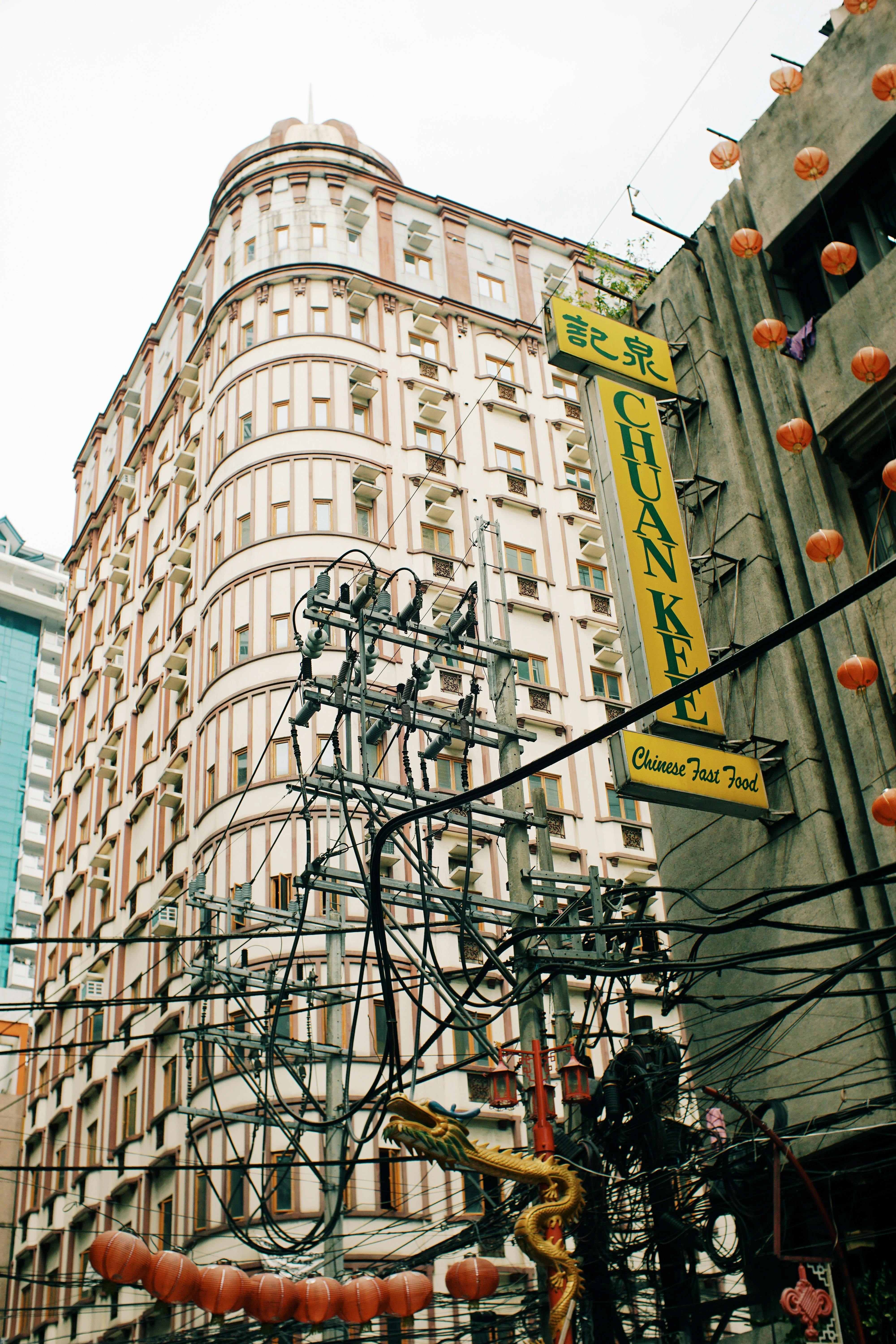 Iconic city street view with historic building and vibrant Chinese signage, perfect for tourism and urban themes.